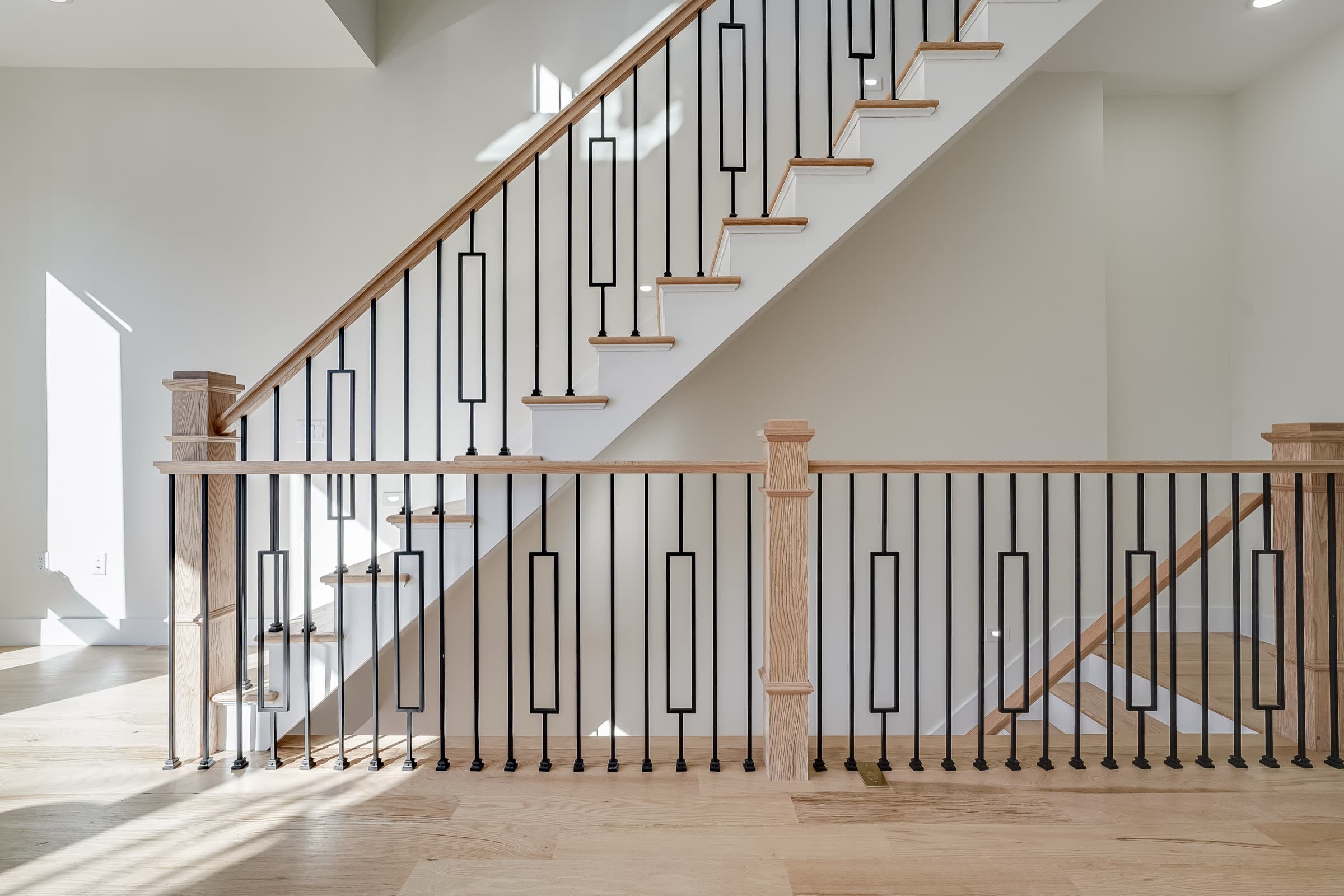 Oak staircase with iron balusters